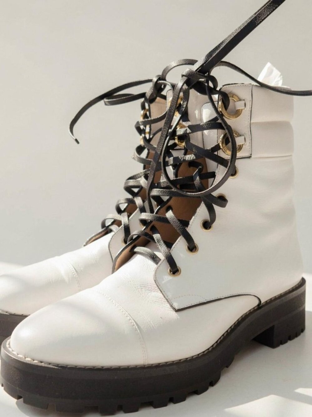 Stuart Weitzman White lace up boots with gold hardware